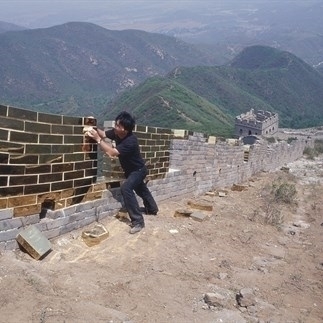 Project to Inlay the Great Wall, titanium plating golden bricks， 2001, Badaling Great Wall, Beijing