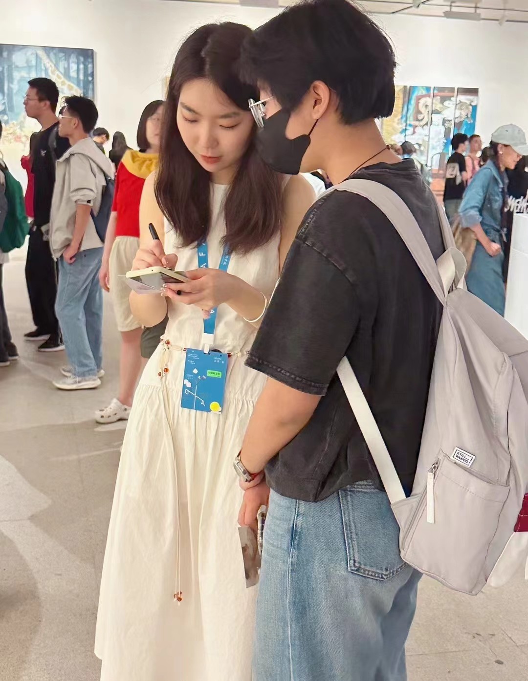 Gao Meng communicated with a visitor at CAFA Art Museum.jpg